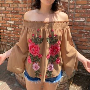 Chiffon goddess blouse with elastic neckline and embroidered floral details